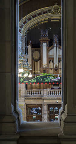 Vertical view of dragon artwork in front of the organ in Kelvingrove Art Gallery and Museum in Glasgow International 2018.
