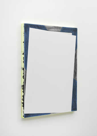 A close up photograph of a canvas on a wall