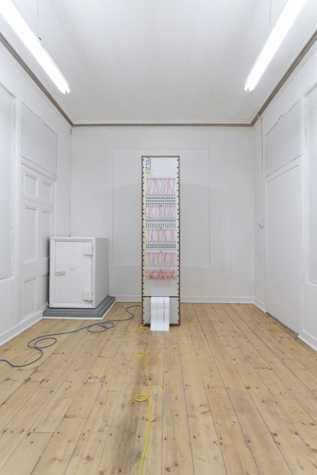 image of mechanical switchboard like device that is printing out paper.