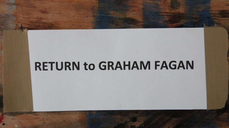 signage reading 'Return to Graham Fagan'