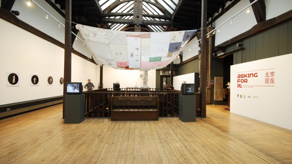 Installation view of the exhibition space at the Glasgow School of Art, showing a number of art works installed around the stairwell