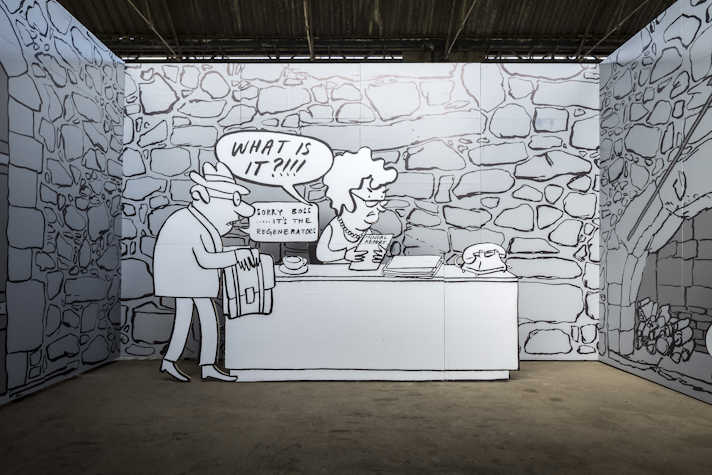 This is a closer look to a drawn black and white mural: an office with a stone wall in the background. The boss has curly short haired and glasses and looks upset. A speech bubble emerges from them saying "WHAT IS IT?!!!". To the left there is a hunched man with glasses and a hat holding a briefcase. His speech bubble reads "Sorry boss..... it's the regenerators".