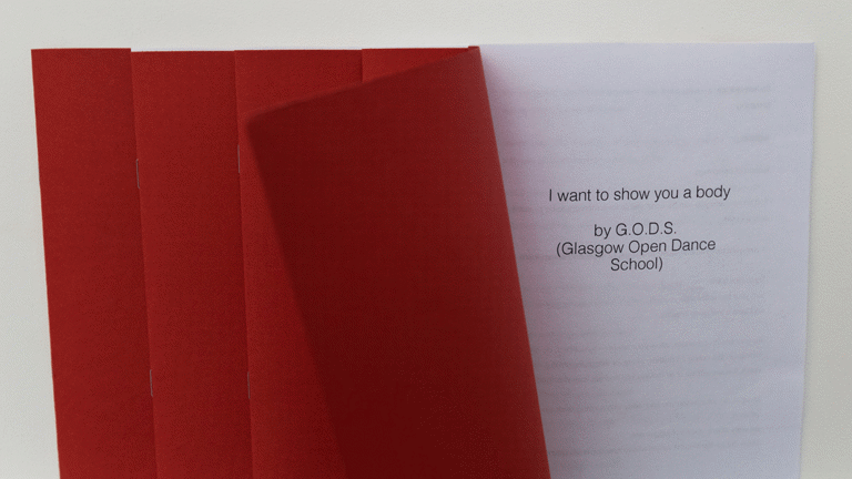 The red cover of an A5 publication is pulled back to show a cover page that reads 'I want to show you a body by G.O.D.S. (Glasgow Open Dance School)'