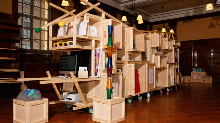 large fun wooden shelves with eclectic items placed on them