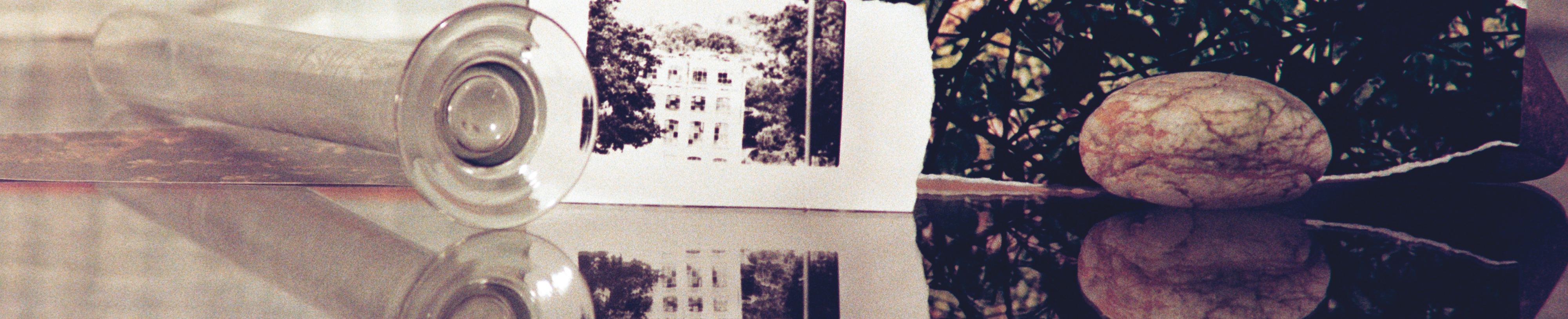 A collage of a picture of a building and a rock beside it