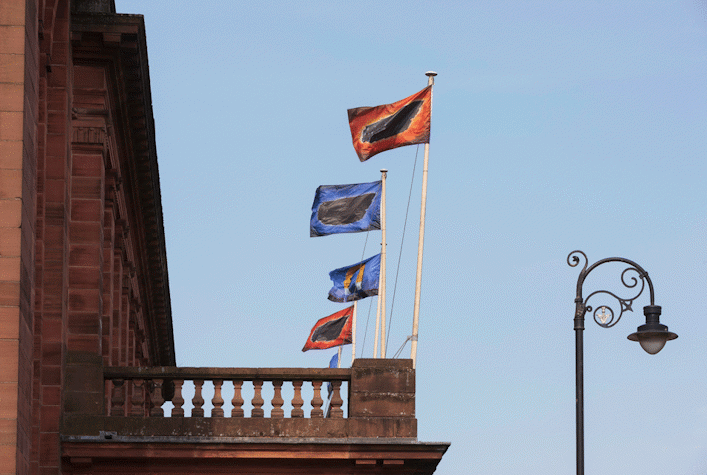 Exterior view of Kelvin Hall with flag poles