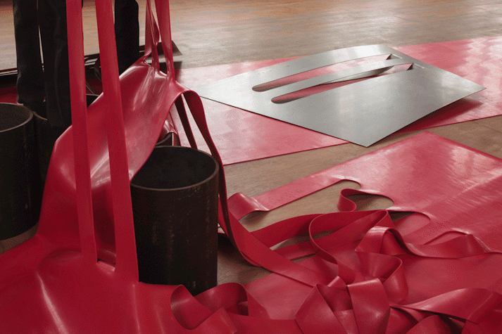 Close up view of sculptural work made of rubber and metal