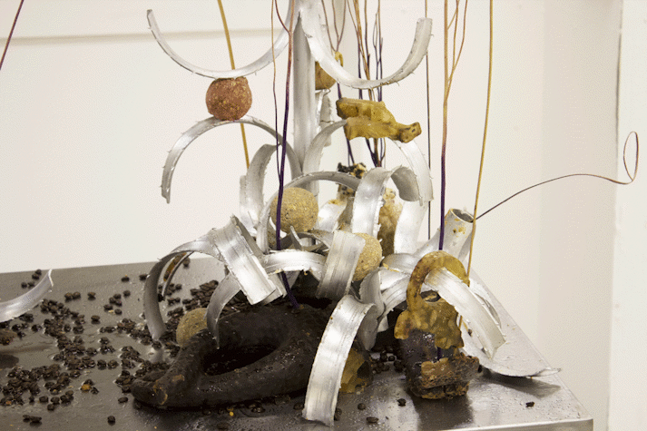 Close up view of a sculpture that includes various materials