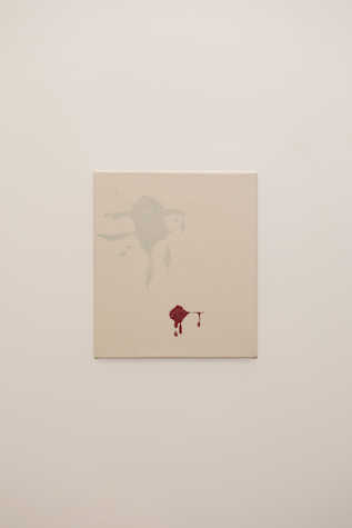 An artwork with coloured splatter marks, in red and pale blue.