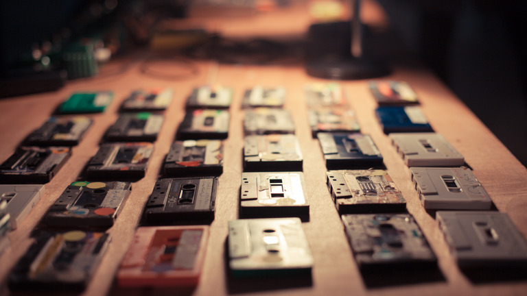 Akio Suzuki & Aki Onda  - cassette tapes laid out on a table