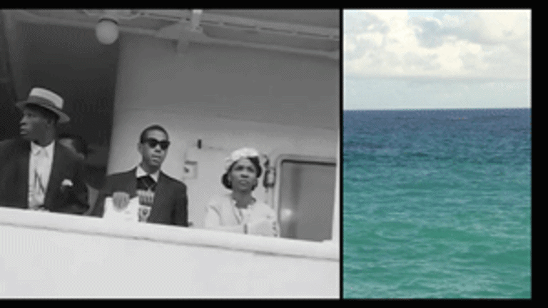 a film still showing an archival image of people on a boat and an image of the sea