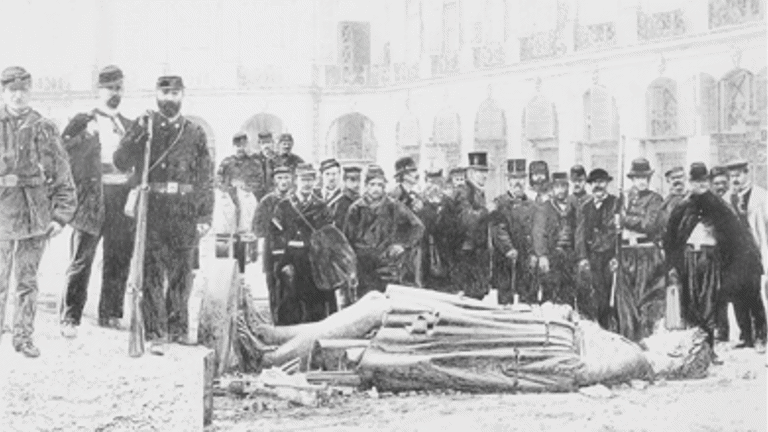 a billboard displays an intricate pencil drawing of a toppled statue, with a group of men standing over the statue