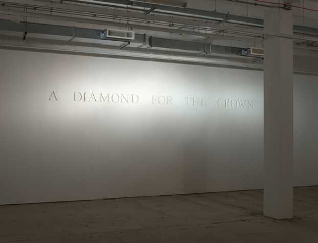 white wall with engraved text, 'A DIAMOND FOR THE CROWN'