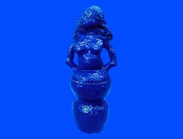 A photo of a sculpture of a woman's head and torso. The sculpture has curly hair and is painted blue. 