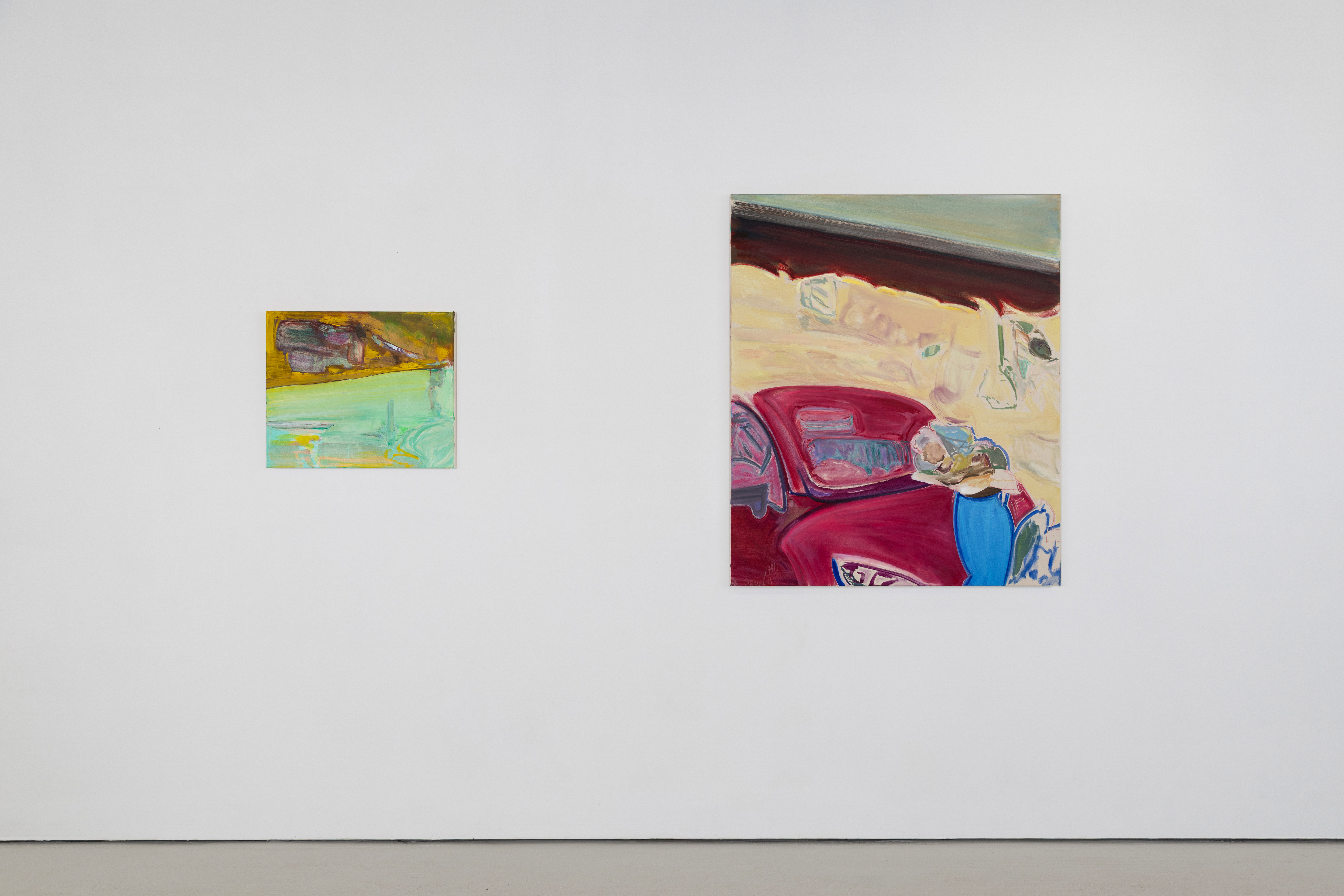Installation view of "Daybook," pairing a small ochre and green painting with a larger canvas depicting a red car-like form and pale wall, both by Amelia Barratt.