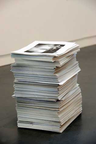 large stack of posters on the floor.