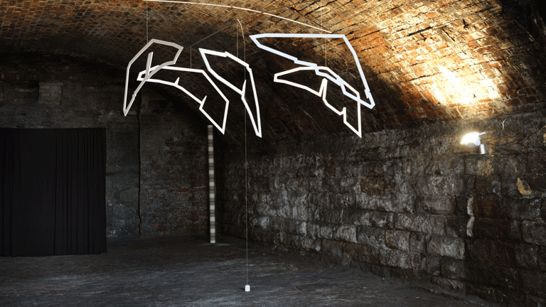 Vaulted basement with suspended neon sculpture 