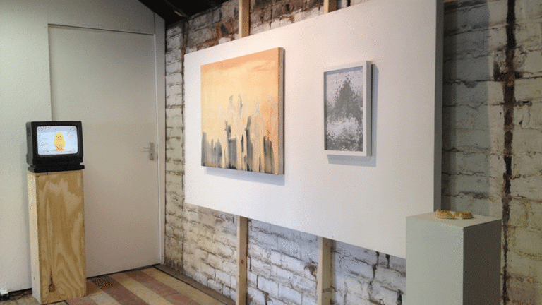 Installation view, paintings hanging on walls, TV monitor on wooden plinth