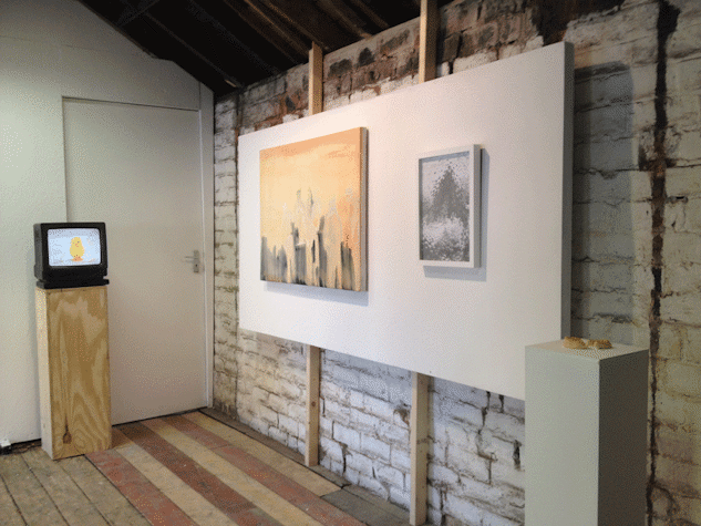 Installation view, paintings hanging on walls, TV monitor on wooden plinth