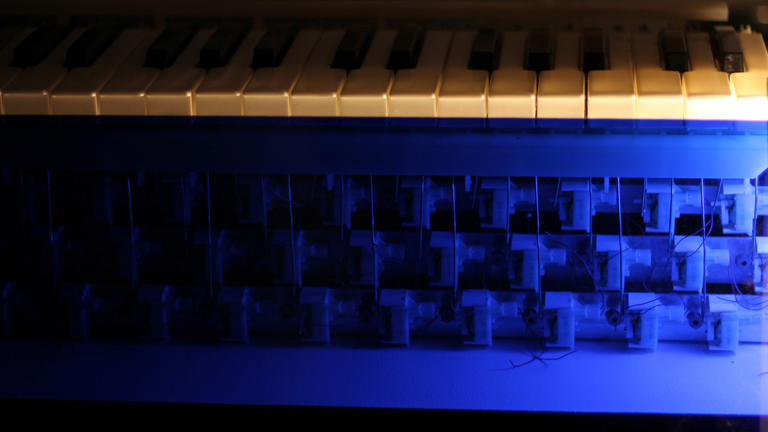 keyboard keys atop blue electrical structure.