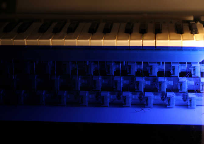 keyboard keys atop blue electrical structure.