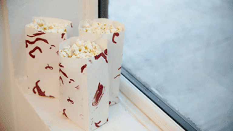 Gallery installation, bags of popcorn on window ledge