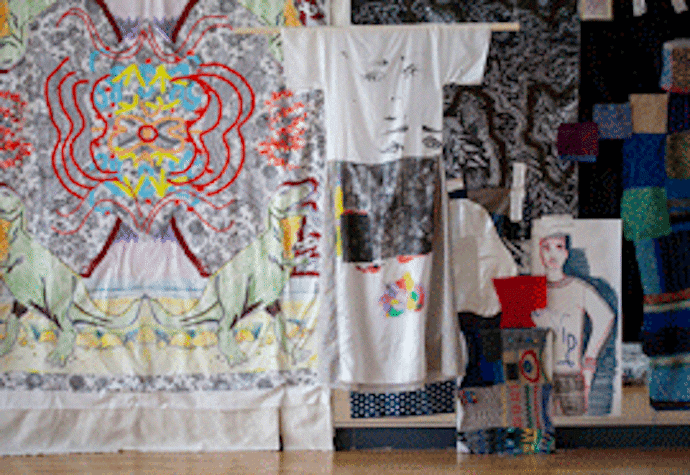 Panels of material suspended with various images printed on the material,